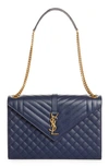 Saint Laurent Monogram Leather Envelope Bag In Blue Charron