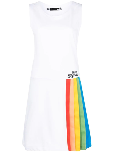white dress with rainbow pleats This white layered dress is a classic, adorned with pastel rainbow  stitching along the layers and adjustable shoulder ties