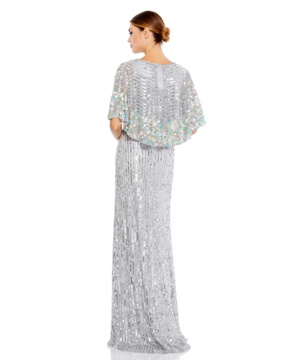 Mac Duggal Sequined V Neck Floral Embellished Cape Sleeve Gown In Platinum