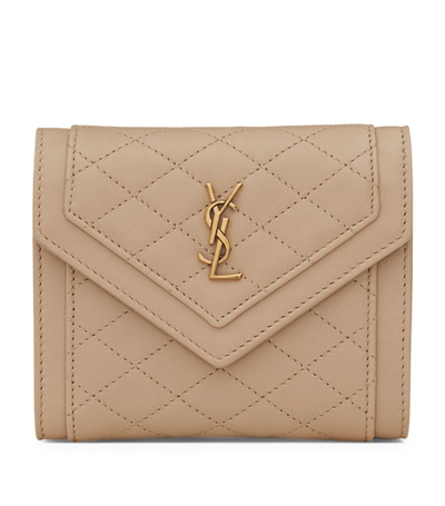 Saint Laurent Quilted Leather Trifold Wallet In Beige