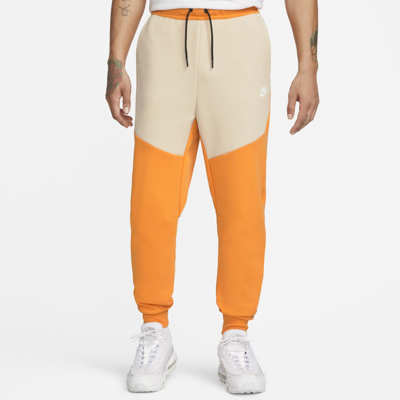 Nike Sportswear Tech Fleece Men's Joggers In Kumquat,sanddrift,white