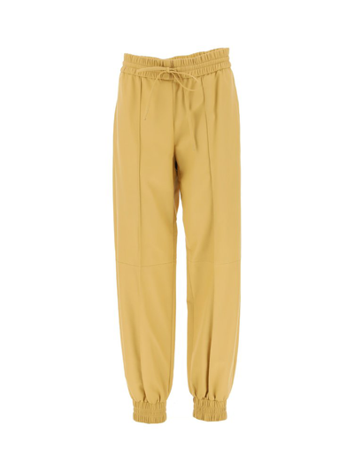 Jil Sander Elasticated Drawstring Waist Tapered Trousers In Beige