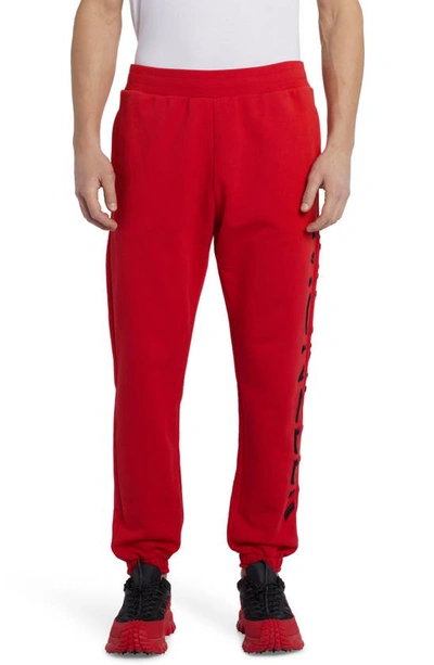 Moncler Embroidered Strike Out Cotton Sweatpants In Red