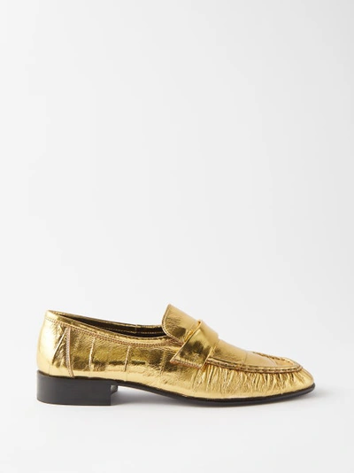 The Row Gathered Metallic Eel Leather Loafers In Gold