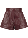 Simkhai Buckled-waist Detail Faux Leather Shorts In Red