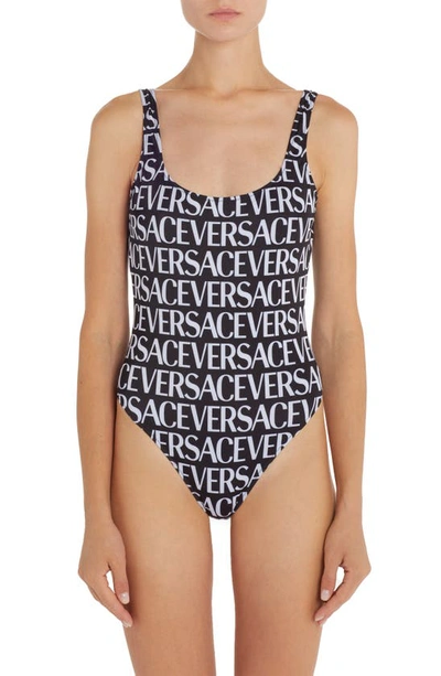 Versace Black And White All-over Logo Print Swimsuit In Black,white