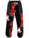 Ambush Printed Panelled Faux Shearling Sweatpants In Schwarz