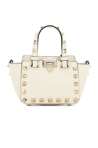 Valentino Garavani Micro Rockstud Tote Crossbody Bag In Light