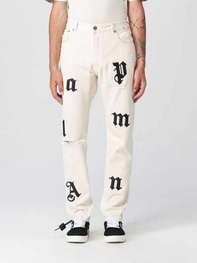 Palm Angels Distressed Logo-patch Straight Leg Jeans In Beige