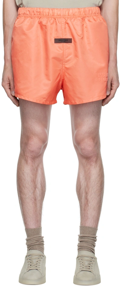 Essentials Wide-leg Logo-flocked Shell Drawstring Shorts In Coral