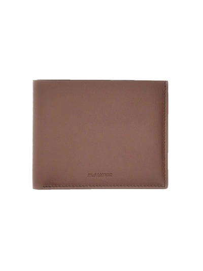 Jil Sander Zipped Wallet In Brown