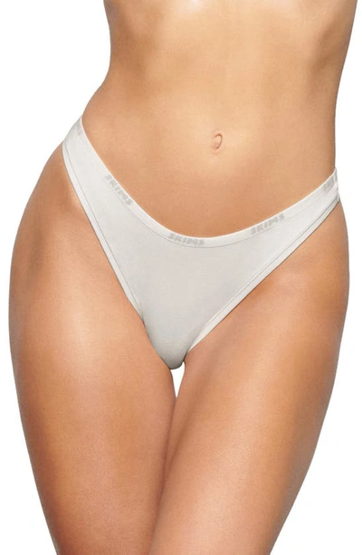 Skims Logo Trim Stretch Cotton Dipped Thong In Marble