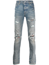 AMIRI DISTRESSED SKINNY JEANS