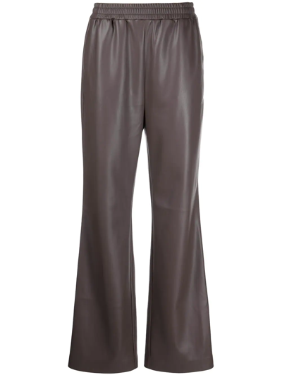 Apparis Flared Faux-leather Trousers In Brown