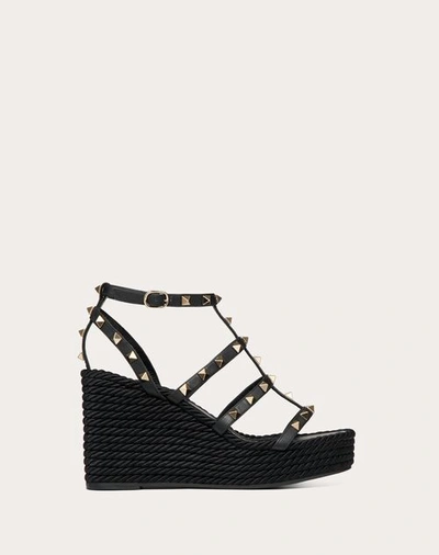 VALENTINO GARAVANI VALENTINO GARAVANI ROCKSTUD ANKLE STRAP WEDGE SANDAL IN CALFSKIN LEATHER 95 MM WOMAN BLACK 42