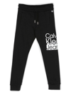 Calvin Klein Tie-dye Logo-print Track Pants In Black