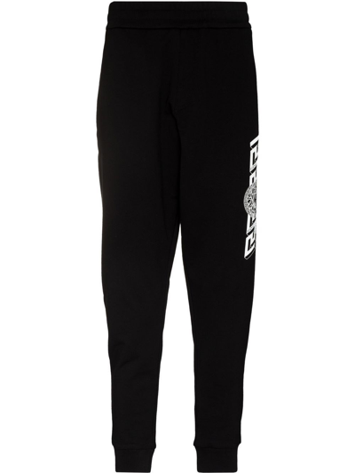 Versace Logo Print Trousers In Nero