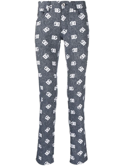 Dolce & Gabbana Slim-cut Monogram-print Jeans In Blau