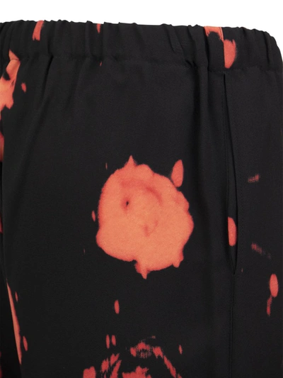 Marni Trousers With Faded Roses Print In Black/red