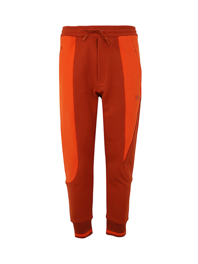 Y-3 U Logo Pants In Orange