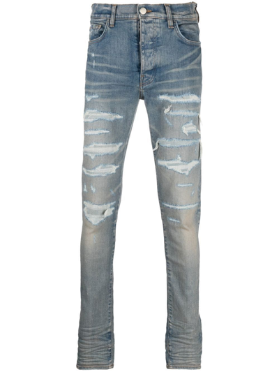 Amiri Distressed-effect Skinny Jeans In Blau