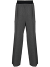 WE11 DONE ELASTICATED TAILORED TROUSERS