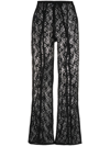 Ganni Lace Sheer Flared Trousers In Schwarz