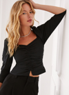 Something Navy Ruched Puff Shoulder Blouse In Black