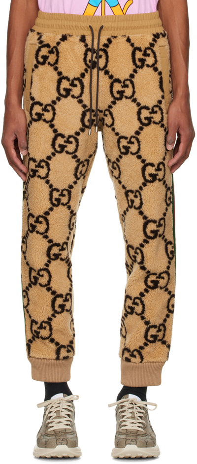 Gucci Striped Logo-jacquard Wool-blend Fleece Sweatpants In Camel