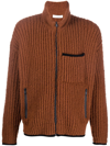 THERE WAS ONE RIBBED BOUCLÉ ZIP-UP CARDIGAN