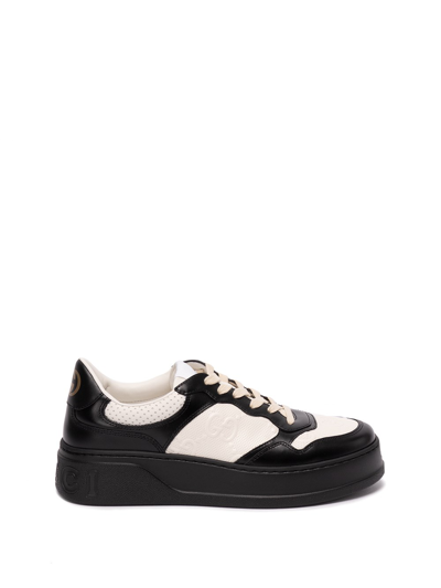 Gucci Black Gg Embossed Low-top Leather Sneakers In Black,white