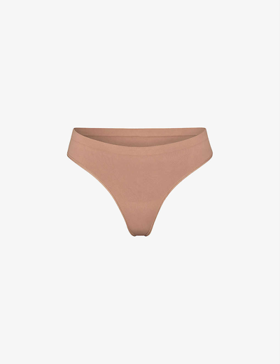 Skims Smoothing Mid-rise Stretch-woven Thong In Brown