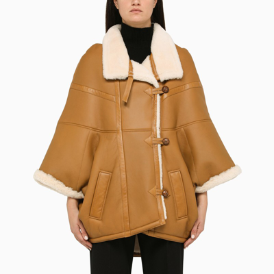 Saint Laurent Oversized Leather Cape With Shearling Lining In Brown
