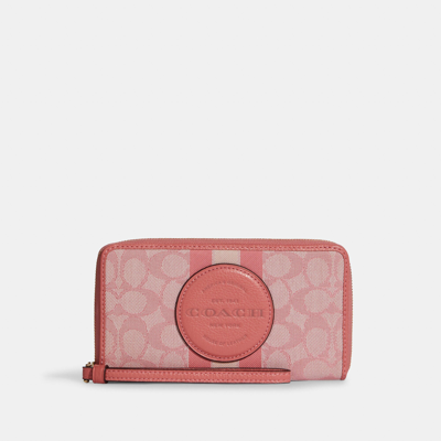 Coach Outlet Dempsey Large Phone Wallet In Signature Jacquard With Stripe And Coach Patch In Multi