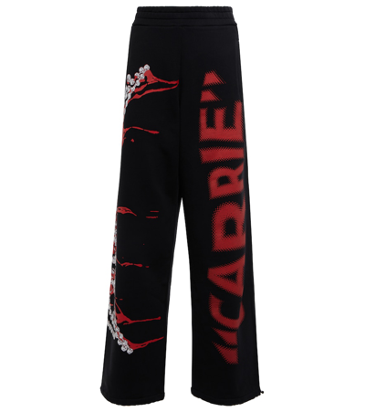 Jw Anderson Printed Cotton Jersey Sweatpants In Black
