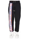 GCDS JOGGING PANTS WITH "CUTE TAPE" LOGO BAND