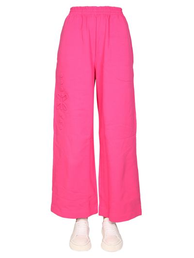 Mcq By Alexander Mcqueen Long Now Embossed Cotton-jersey Wide-leg Track Trousers In Fuchsia