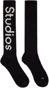 Acne Studios Logo-jacquard Ribbed Stretch Cotton-blend Socks In Black