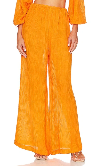 Faithfull The Brand Rupina Flare Leg Crinkle Pants In Tangerine