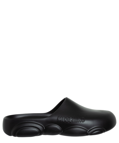 Moschino Logo Embossed Sandals In Black