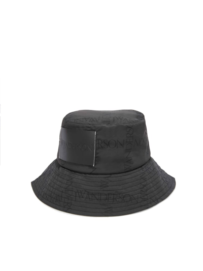 Jw Anderson Asymmetric Logo Print Bucket Hat In Black