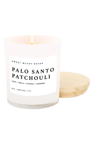 Sweet Water Decor Palo Santo Patchouli 11 Oz. Candle In White