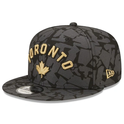 New Era Men's  Gray Toronto Raptors 2022/23 City Edition Official 9fifty Snapback Adjustable Hat