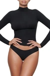 Skims Cotton Jersey Turtleneck Long Sleeve Tee In Onyx In Onyx