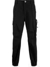Versace Elasticated Waistband Drawstring Pocket Detailed Trousers In Black
