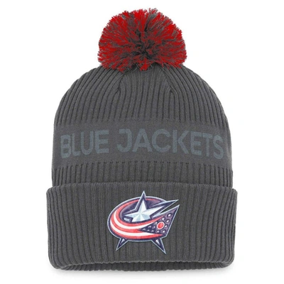FANATICS FANATICS BRANDED CHARCOAL COLUMBUS BLUE JACKETS AUTHENTIC PRO HOME ICE CUFFED KNIT HAT WITH POM