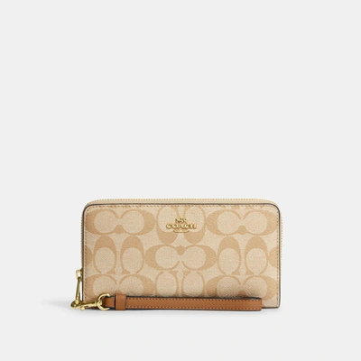 Coach Outlet Long Zip Around Wallet In Signature Canvas In Im/light Khaki/light Saddle