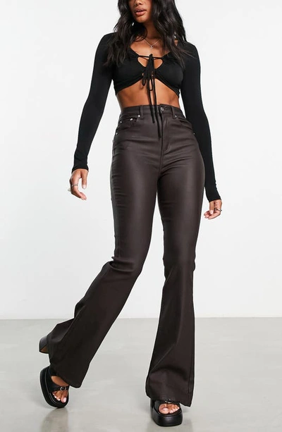 Asos Design Power Stretch Flared Jeans In Coated Chocolate Brown