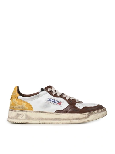 Autry Sneakers In Leather With Used Effect In Brown