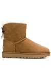 Ugg Mini Bailey Bow Boots In Beige